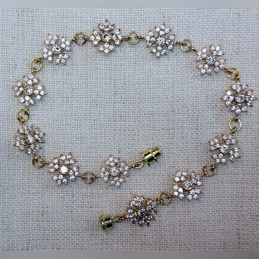 Stunning Bracelet - 18K Real gold plated sparkling white CZ snowflakes. 8”.GIFT